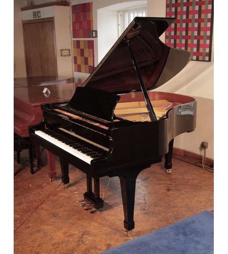 Reconditioned, 2001, Boston GP178 II grand piano for sale with a black case and spade legs. Piano has an eighty-eight note keyboard and a three-pedal lyre. 
