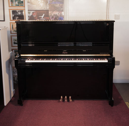 Reconditioned, 2010, Boston UP-132 Upright Piano For Sale with a Black Case and Brass Fittings. Boston pianos are designed by Steinway. Piano has an eighty-eight note keyboard and three pedals..