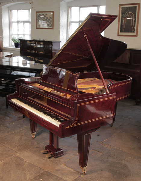 Restored, 1910, Grotrian Steinweg grand piano for sale with a mahogany case and satinwood stringing accents. Piano has an eighty-eight note keyboard and a two-pedal lyre. 