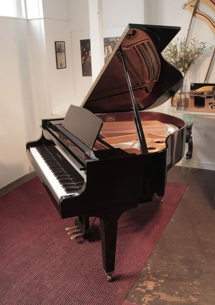 Reconditioned, 1987, Kawai GE-1 baby grand piano for sale with a black case and square, tapered legs