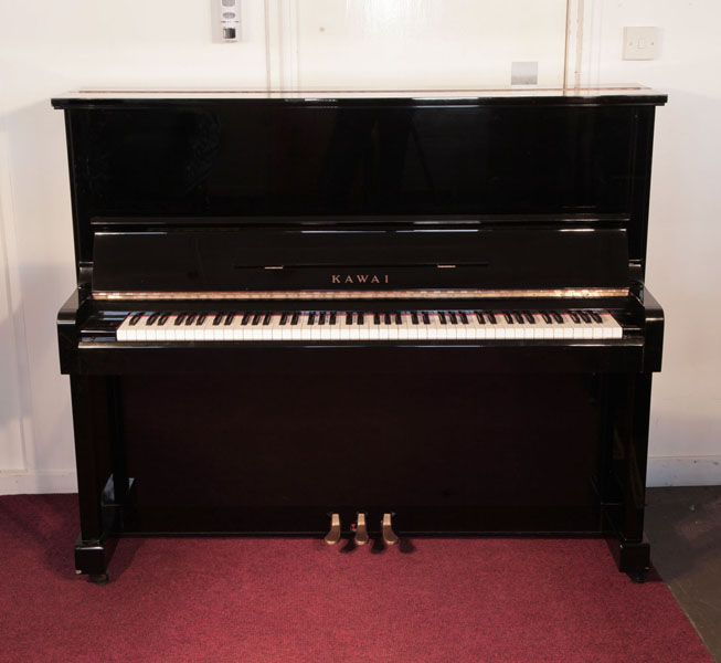Reconditioned, 1982, Kawai KS-2F Upright Piano For Sale with a Black Case and Brass Fittings. Piano has an eighty-eight note keyboard and three pedals.  