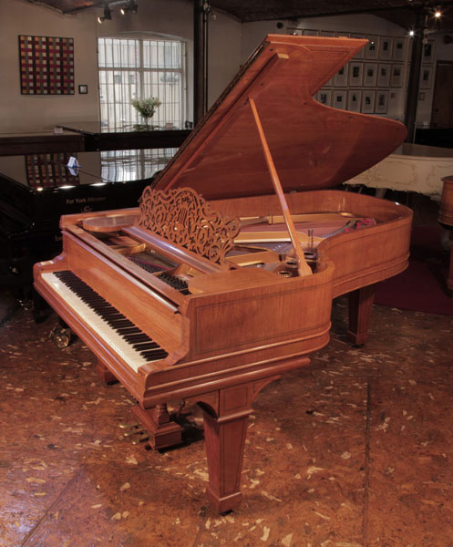 Reconditioned, 1900, Steinway Model B grand piano for sale with a satinwood case. Entire cabinet inlaid with boxwood stringing accents. Piano has an eighty-eight note keyboard and a three-pedal lyre 