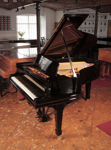Rebuilt, 1910, Steinway Model O grand piano with a with a black case and brass fittings Piano has an eighty-five note keyboard and a two-pedal lyre.  