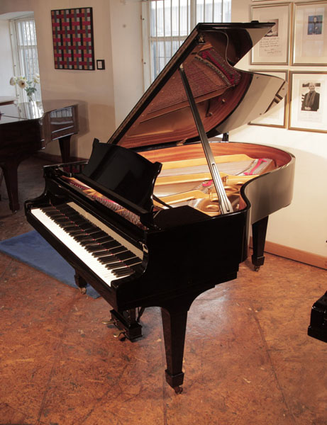 Rebuilt, 1975, Steinway Model O grand piano for sale with a black case and spade legs. Piano has been rebuilt in Germany by Steinway Academy trained technicians using 100% Steinway parts. Piano has an eighty-eight note keyboard and a two-pedal lyre.