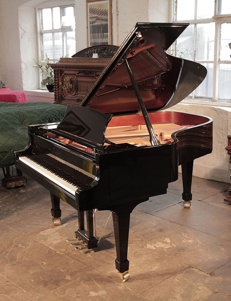 Brand new, Toyama TC-187 grand piano for sale with a black case and spade legs