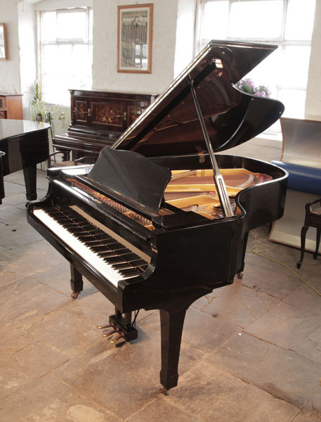 Reconditioned, 1970, Yamaha C3 grand piano for sale with a black case and spade legs. Piano has an eighty-eight note keyboard and a three-pedal lyre.  