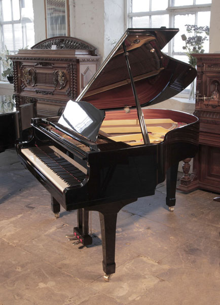 Reconditioned, 1987, Yamaha G1 baby grand piano for sale with a black case and square, tapered legs Piano has an eighty-eight note keyboard and a two-pedal lyre. 