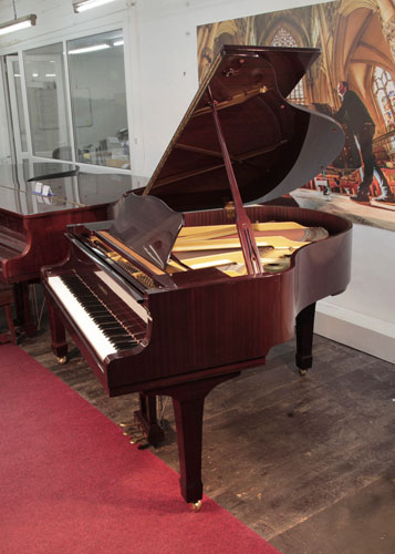 Reconditioned, 1989, Yamaha G1 baby grand piano with a mahogany case and spade legs. Piano has an eighty-eight note keyboard and a three-pedal lyre.  