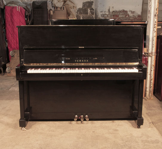  Reconditioned, 1994, Yamaha U1 upright piano with a black case and polyester finish. Piano has an eighty-eight note keyboard and three pedals. 