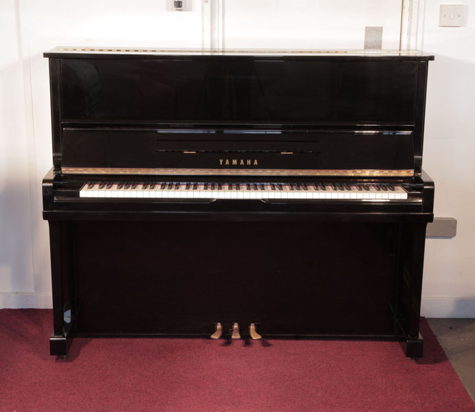 Reconditioned, 1990, Yamaha U10A upright piano with a black case and polyester finish. Piano has an eighty-eight note keyboard and three pedals
