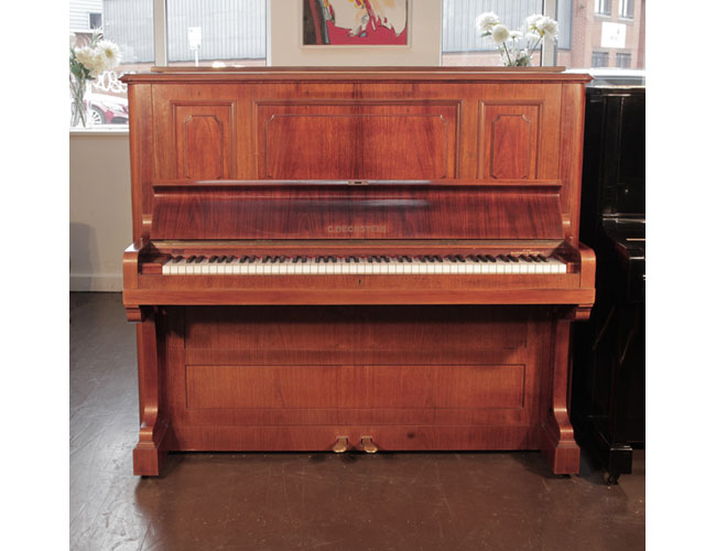 Antique,  1924, Bechstein model 8 upright piano with a rosewood case and brass fittings. Piano has an eighty-eight note keyboard and two pedals. 