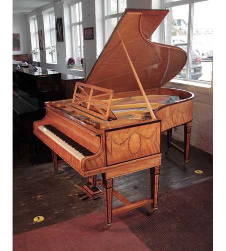 Restored, 1910, Bechstein Model B grand piano with a book-matched, satinwood case with boxwood stringing. Piano has gate legs attached with a cross stretcher. Entire cabinet inlaid with swagged bellflowers and bows.