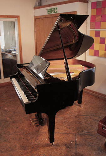 Reconditioned,  2009, Boston GP156 II baby  grand piano for sale with a black case and spade legs. Piano has an eighty-eight note keyboard and a three-pedal lyre.