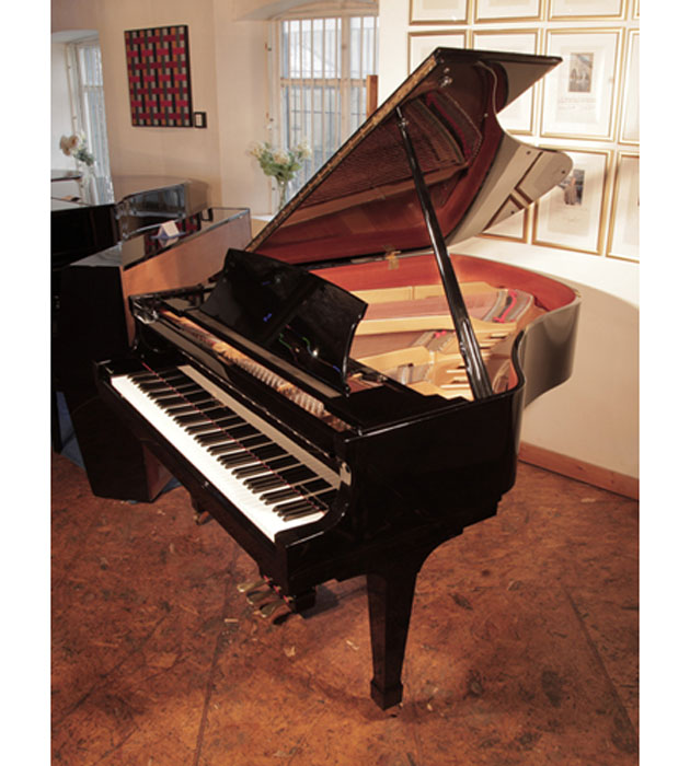 Reconditioned, 1993, Boston GP178  grand piano for sale with a black case and spade legs. Piano has an eighty-eight note keyboard and a three-pedal lyre. 