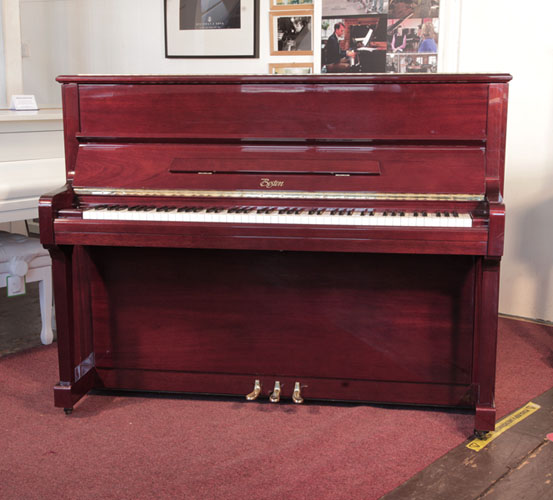 Reconditioned, 1999,  Boston UP-118E upright piano for sale with a mahogany gloss case and brass fittings. Piano has an eighty-eight note keyboard and three pedals.