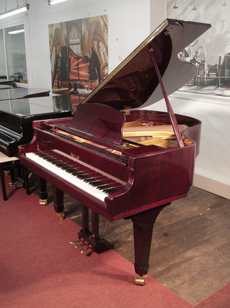 Reconditioned, 2000, Eavestaff F158 baby grand piano for sale with a mahogany case and spade legs Piano has an eighty-eight note keyboard and a three-pedal lyre. 