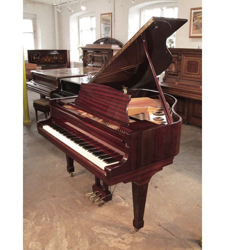 Reconditioned, 1986, Kawai KG-1D baby grand piano with a mahogany case and spade legs. Piano has an eighty-eight note keyboard and a three-pedal lyre.