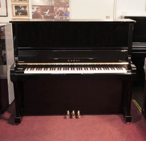 Reconditioned, 2004, Kawai VT-132 Upright Piano For Sale with a Black Case and Brass Fittings. Piano has an eighty-eight note keyboard and three pedals. 