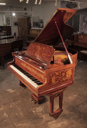 Restored, 1913, Lipp baby grand piano with a walnut case. Entire cabinet inlaid with cherubs, figures and neoclassical motifs. Piano has an eighy-eight note keyboard and two pedals. 