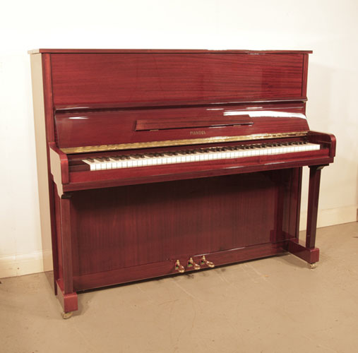 Reconditioned,  2000, Pianova upright piano with a mahogany case and brass fittings. Piano has an eighty-eight note keyboard and three pedals