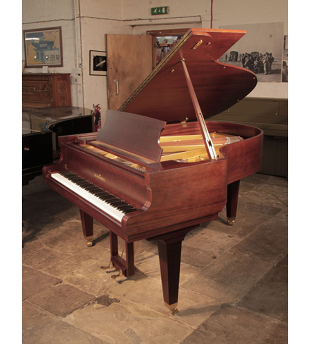 Reconditioned, 1987, Yamaha C3 grand piano for sale with a mahogany case and spade legs. Piano has an eighty-eight note keyboard and a three-pedal lyre. 