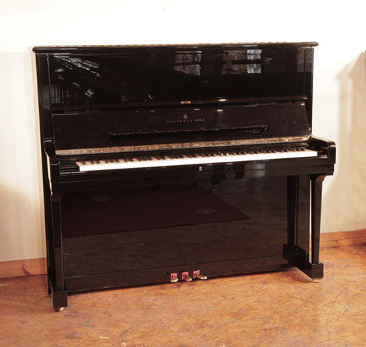 Reconditioned, 1990, Steinway Model K upright piano for sale with a black case and brass fittings. Piano has an eighty-eight note keyboard and three pedals.  Piano has a third sostenuto pedal.  