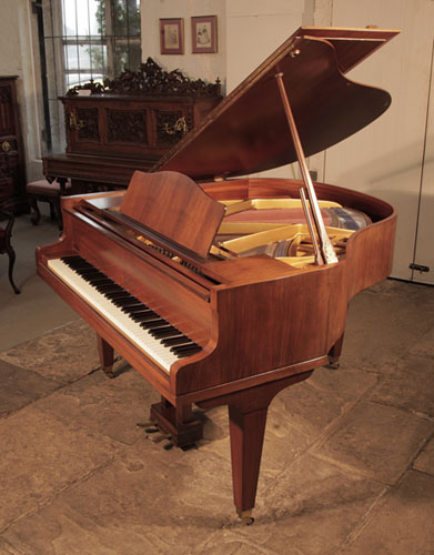 Reconditioned, 1970, Welmar baby grand piano for sale with a mahogany case and square, tapered legs. Piano has an eighty-eight note keyboard and a two-pedal lyre. 