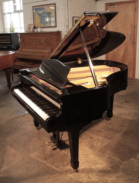 Reconditioned, 1982, Yamaha G2 grand piano for sale with a black case and spade legs. Piano has an eighty-eight note keyboard and a two-pedal lyre.
 