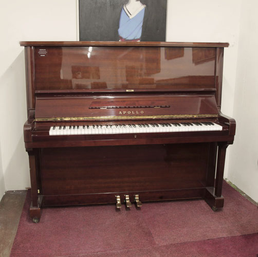 Pre-owned, Apollo A360 upright piano with a mahogany gloss case and Renner action. A large-sized, solid piano ideal for a school. Piano has an eighty-eight note keyboard and three pedals. 