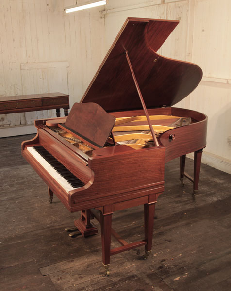 A 1920s, Bechstein Model B grand piano with a mahogany case and gate legs. Piano has an eighty-eight note keyboard and a two-pedal lyre