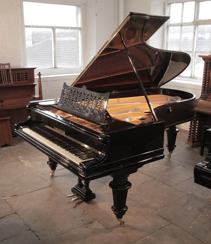 An 1897, Bechstein Model D grand piano for sale with a polished, black case and turned, faceted legs