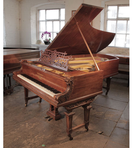 Reconditioned 1893, Bechstein Model D concert grand piano for sale with a stunning, dark-veined, walnut case and Neoclassical carvings. Piano has an eighty-eight note keyboard and a two-pedal lyre. 
