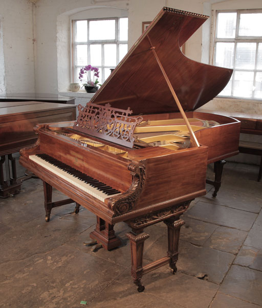 Antique, 1899, Bechstein model V grand piano for sale with a rosewood case and turned, faceted legs.  Piano has an eighty-eight note keyboard and a two-pedal lyre. 