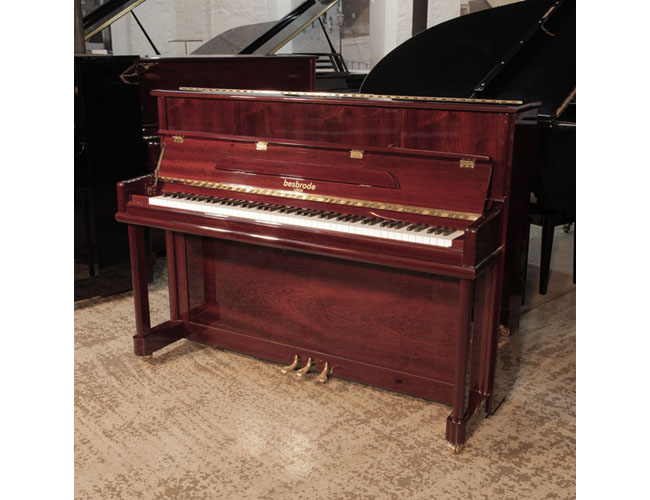 Reconditioned 2016, Besbrode SU112 upright piano for sale with a mahogany gloss case. Piano has an eighty-eight note keyboard and three pedals.
