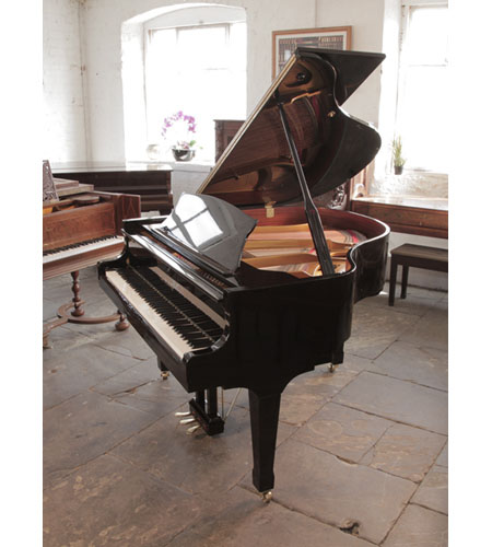 Reconditioned Carl Steinberg baby  grand piano for sale in black gloss. Piano has an eighty-eight note keyboard and a three-pedal lyre.