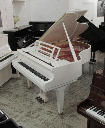 Brand new, Feurich Model 179 Dynamic  grand piano in white gloss with brass fittings. Piano has an eighty-eight note keyboard and a three-pedal piano lyre. 