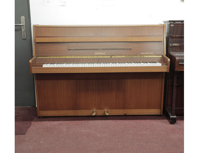 Vintage, Hupfeld Norma upright piano with a mahogany case. Piano has an eighty-eight note keyboard and two pedals 