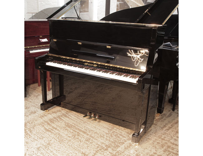Reconditioned 2016, Perzina GP-129 upright piano for sale in black gloss. Piano has an eighty-eight note keyboard and three pedals.