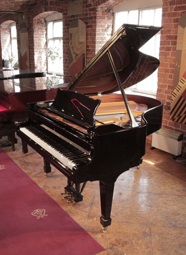 Reconditioned, 1996, Steinway Model M grand piano with a with a black case and brass fittings. Piano has an eighty-eight note keyboard and a three-pedal lyre. 