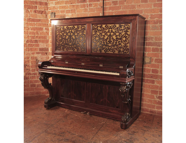Rare, 1862, Steinway upright piano for sale with a polished, rosewood case carved, reverse scroll legsReconditioned, 1986, Steinway Model V upright piano with a black case and brass fittings