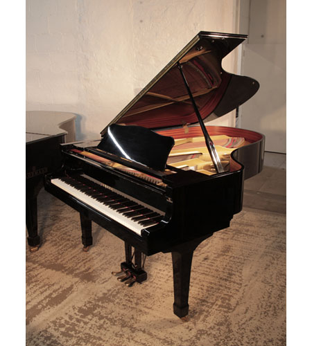 Reconditioned,A 1981, Yamaha C5 grand piano for sale with a black gloss case and spade legs.