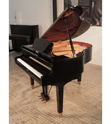 Reconditioned, 2005,  Yamaha GB1 baby grand piano for sale with a black, gloss case and square, tapered legs. Piano has an eighty-eight note keyboard and a three-pedal lyre. 
