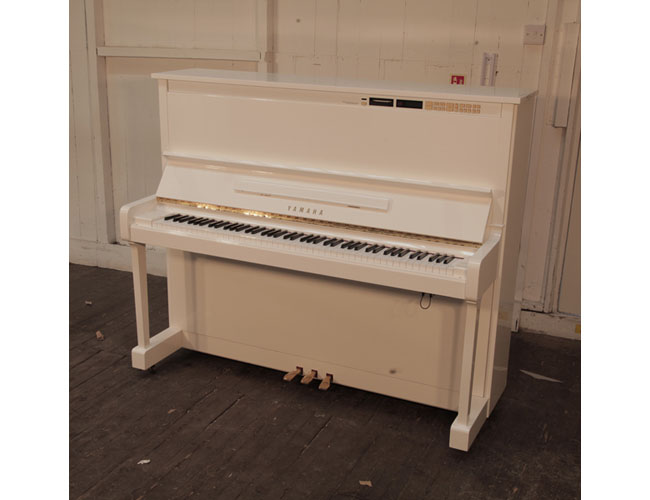 Upgraded 1988, Yamaha MX100A Disklavier upright piano in white gloss. Piano has an eighty-eight note keyboard and three pedals.