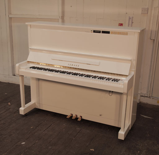 Upgraded, 1988, Yamaha MX100A Disklavier upright piano in white gloss. Piano has an eighty-eight note keyboard and three pedals.