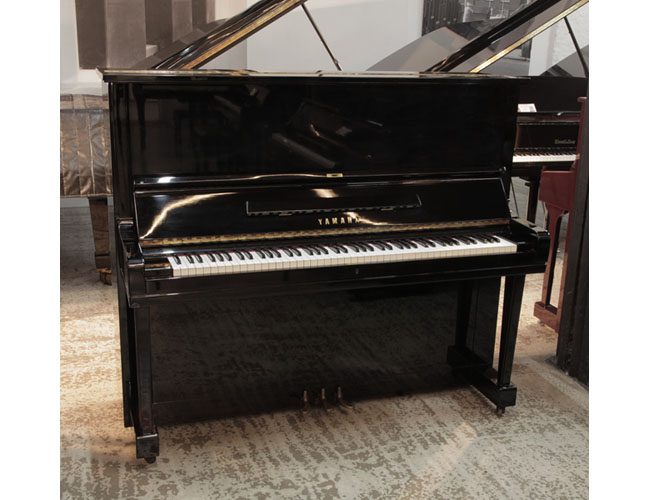 A 1957, Yamaha U3 upright piano for sale with a black gloss case and brass fittings. Piano has an eighty-eight note keyboard and three pedals