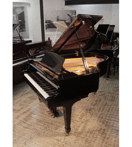 Reconditioned 2011, Young Chang G-185 professional grand piano in black gloss. Piano has an eighty-eight note keyboard and a three-pedal lyre. 