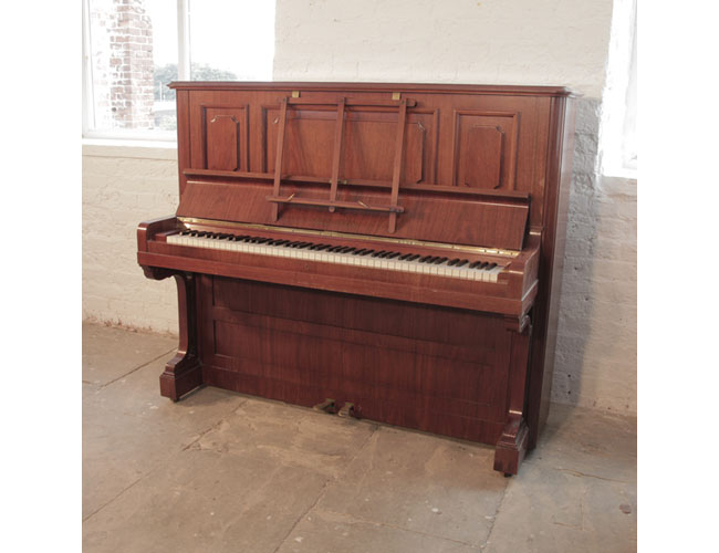 Antique,  1923, Bechstein model 8 upright piano with a rosewood case and brass fittings. Piano has an eighty-eight note keyboard and two pedals. 