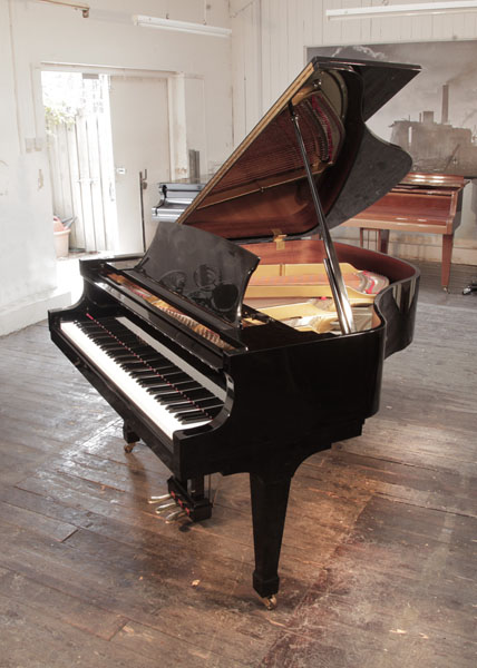 Reconditioned 1999, Boston GP156 II baby grand piano for sale with a black case and spade legs. Piano has an eighty-eight note keyboard and a three-pedal lyre.