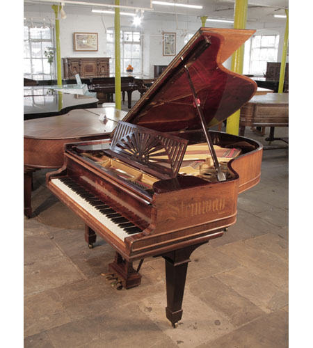 Reconditioned 1911, Steinway Model A grand piano for sale with a polished, rosewood case. The Steinway name is inlaid on the piano cheek in calligraphy style. 