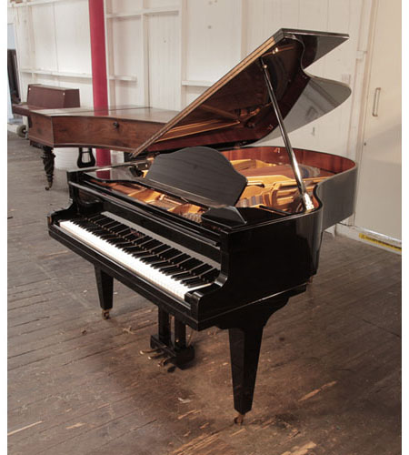 Reconditioned, 1985, Welmar grand piano for sale in black gloss. Made in England.  Piano has an eighty-eight note keyboard and a three-pedal lyre.